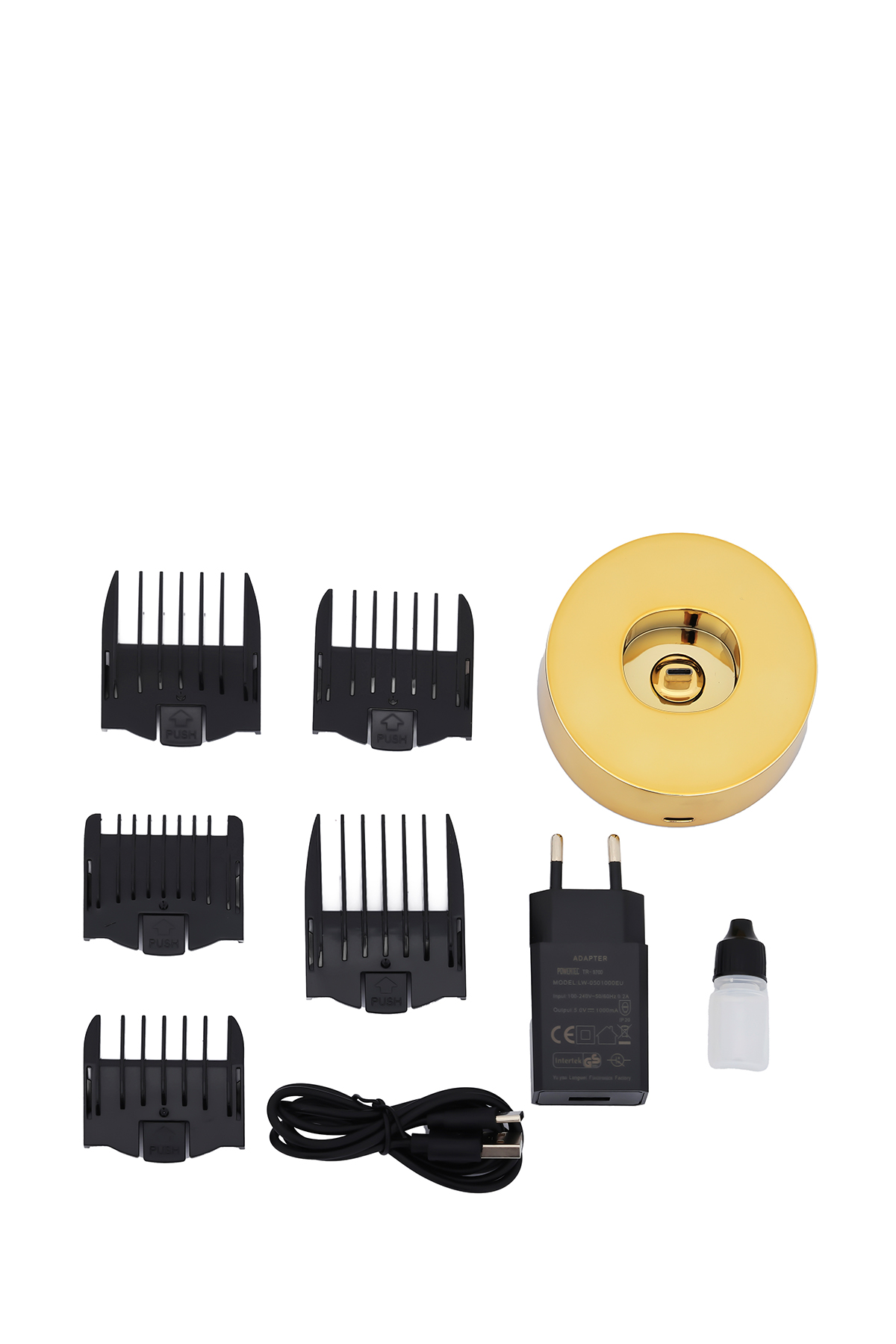 Altın rengi şarj tabanı, siyah saç kesme makinesi koruyucuları, USB kablosu, adaptör ve yağ şişesi.