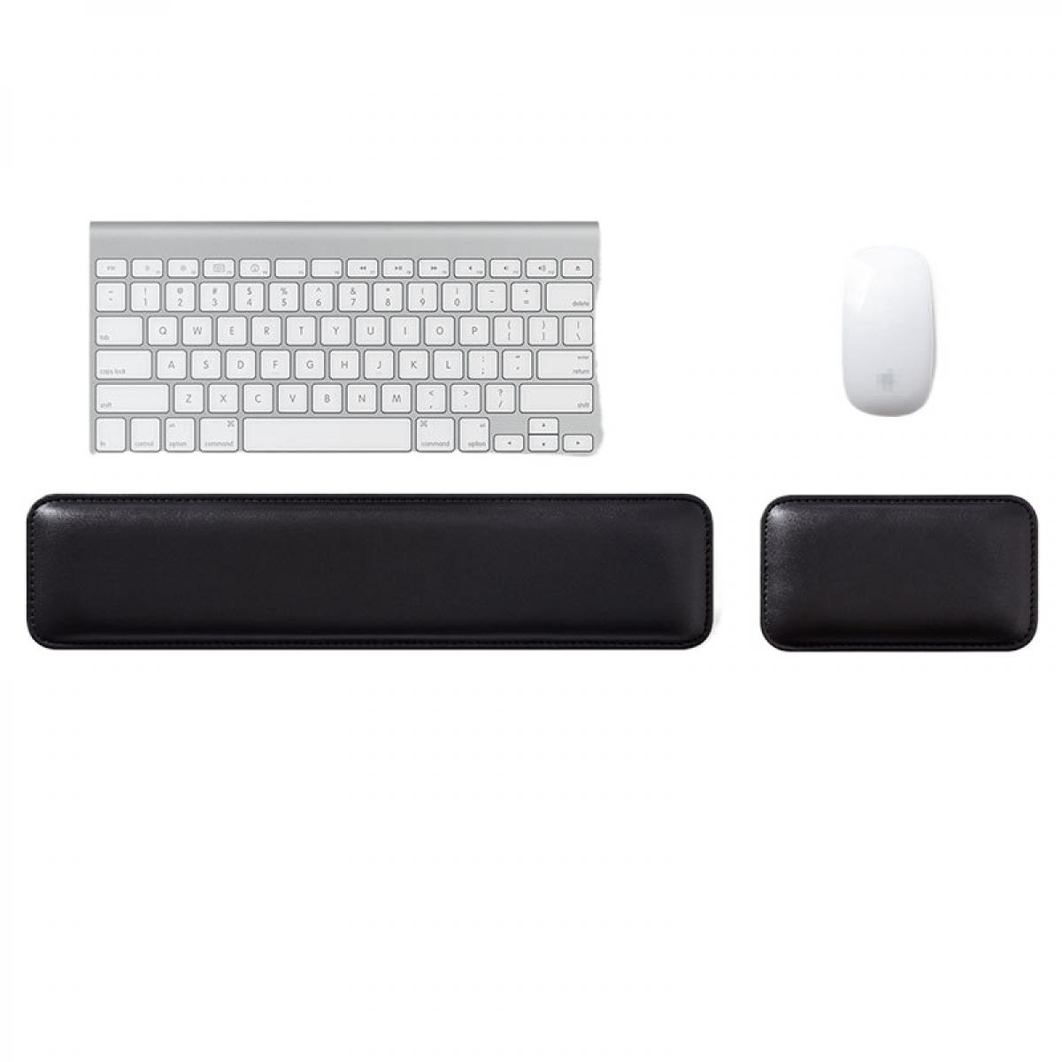 Silberne Tastatur, weiße Maus und schwarze Handgelenkauflagen.