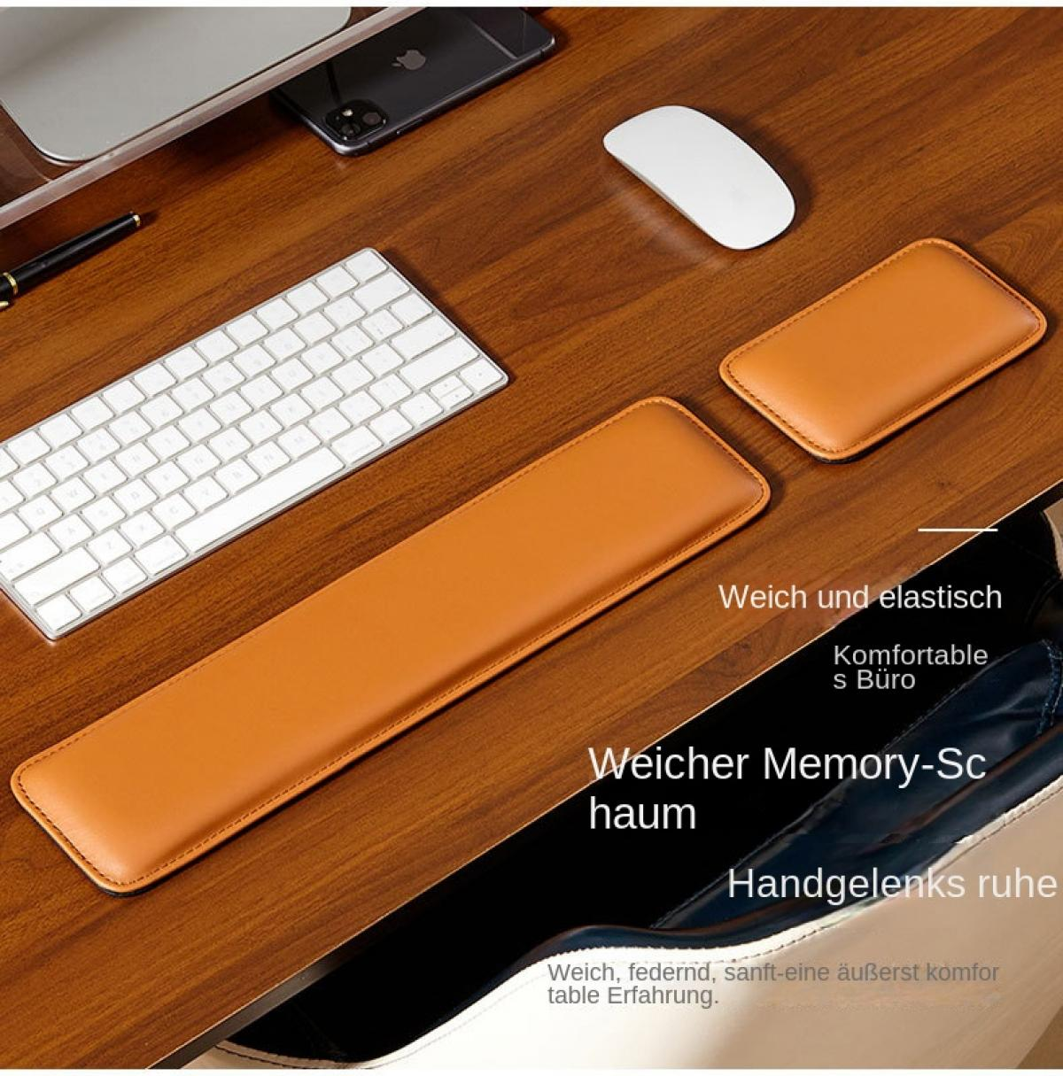 Ein Schreibtisch mit Tastatur, Maus, Handgelenkauflage und einem Smartphone.