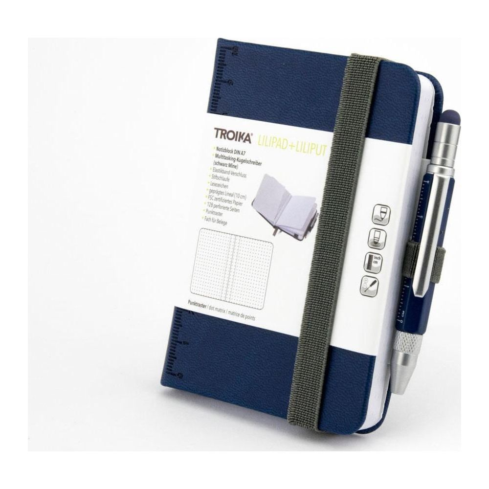 Ein dunkelblaues Notizbuch mit Stift und Gummiband. Mit Lineal und Notizen.