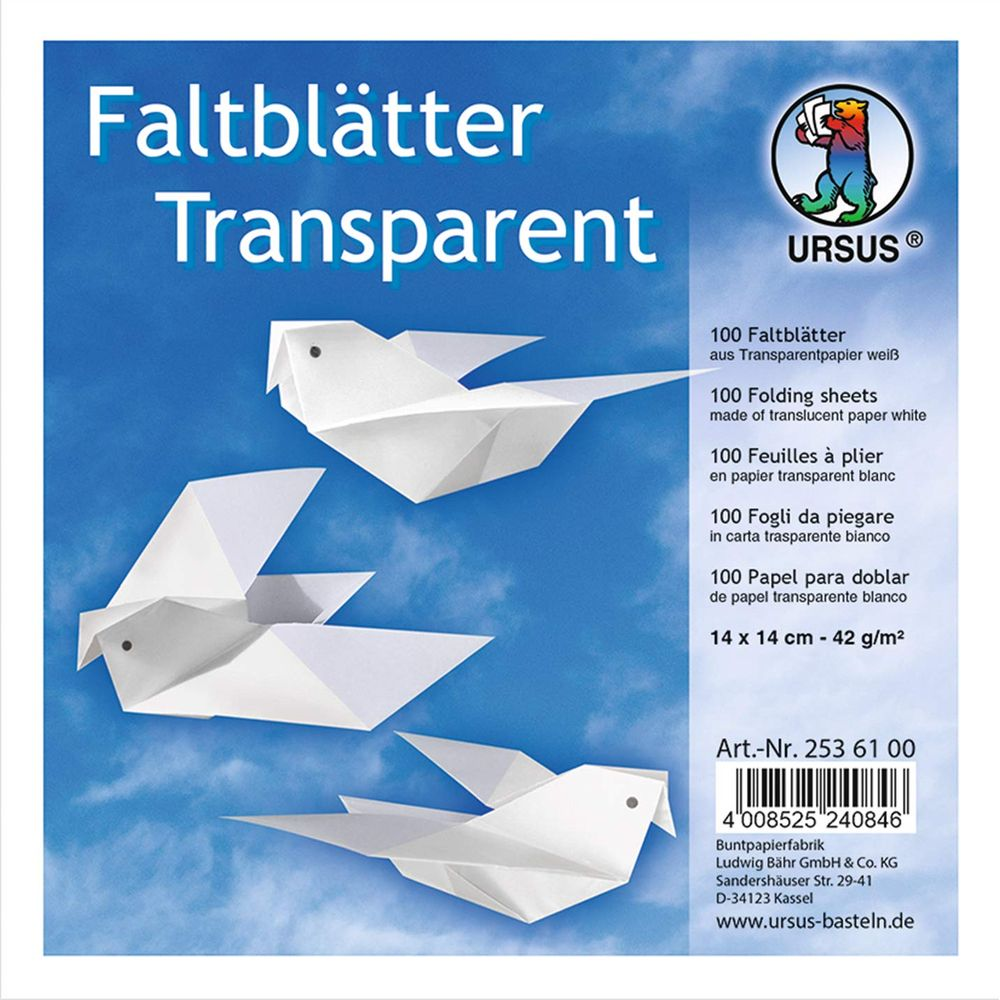 Drei weiße Papierkraniche fliegen vor blauem Himmel.