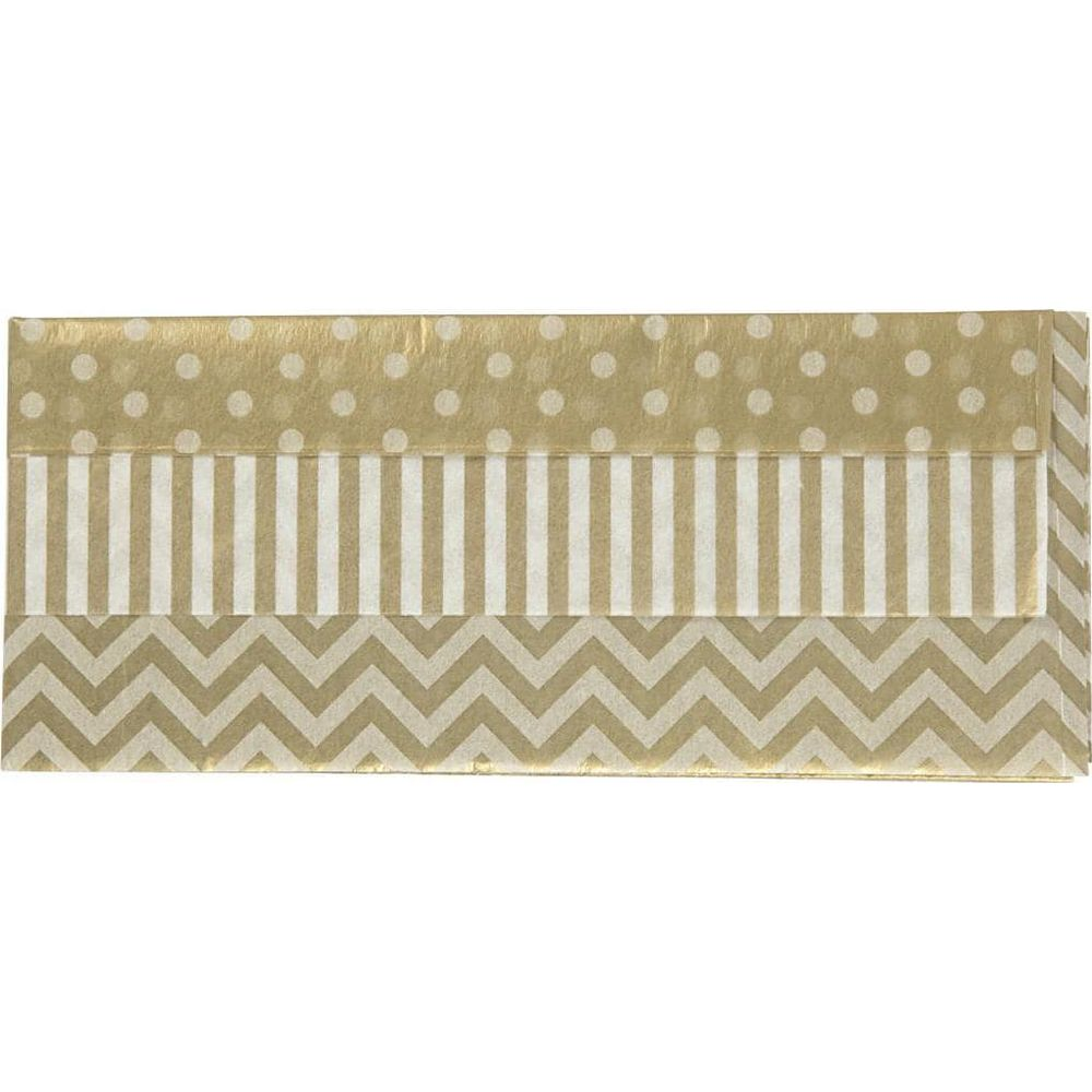 Papier cadeau doré à pois blancs, rayures et motif en chevron.