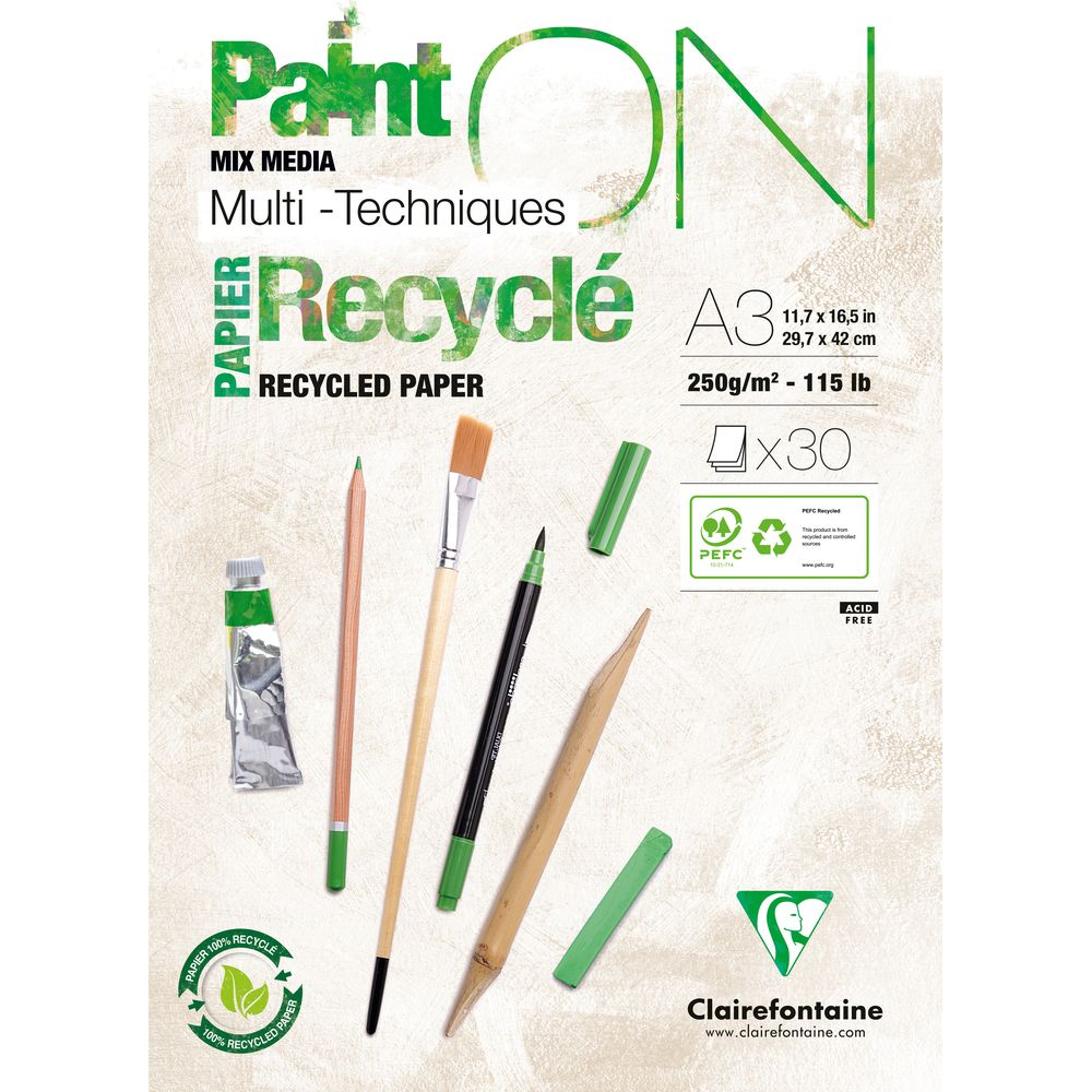 Papier, Stifte, Pinsel, Tube, Pastellkreiden auf einem Blatt Recyclingpapier.