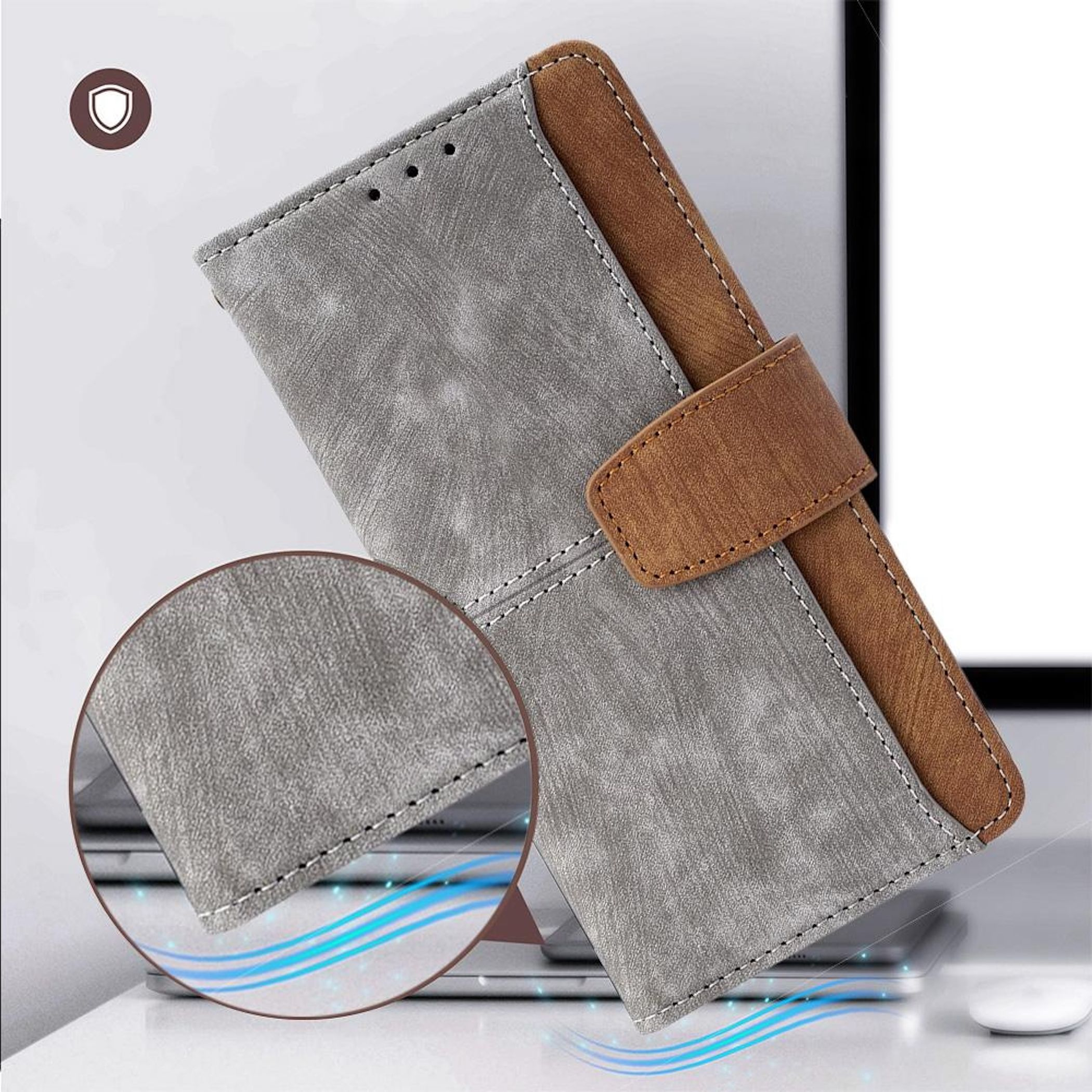 Graue und braune Handyhülle mit Nahtdetails, auf einem Laptop.