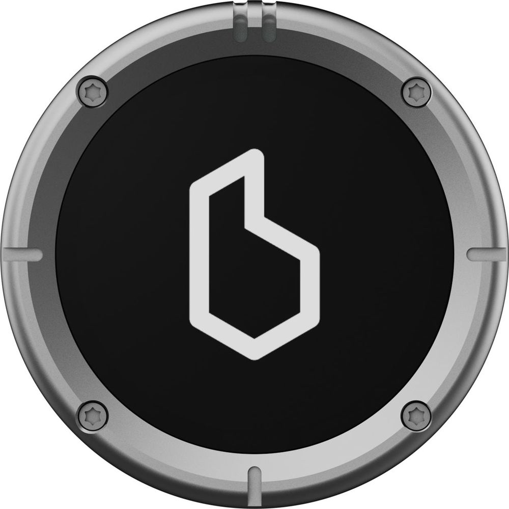 Ein silberner Kreis mit schwarzem Zentrum und einem weißen, sechseckigen Symbol.