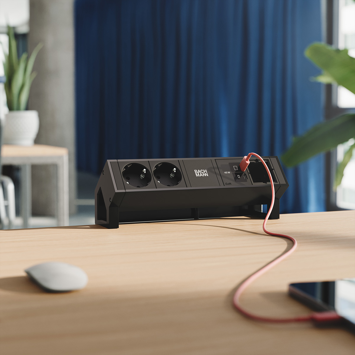 Schwarze Steckdosenleiste mit zwei Steckdosen, USB-C und USB-A-Anschlüssen.