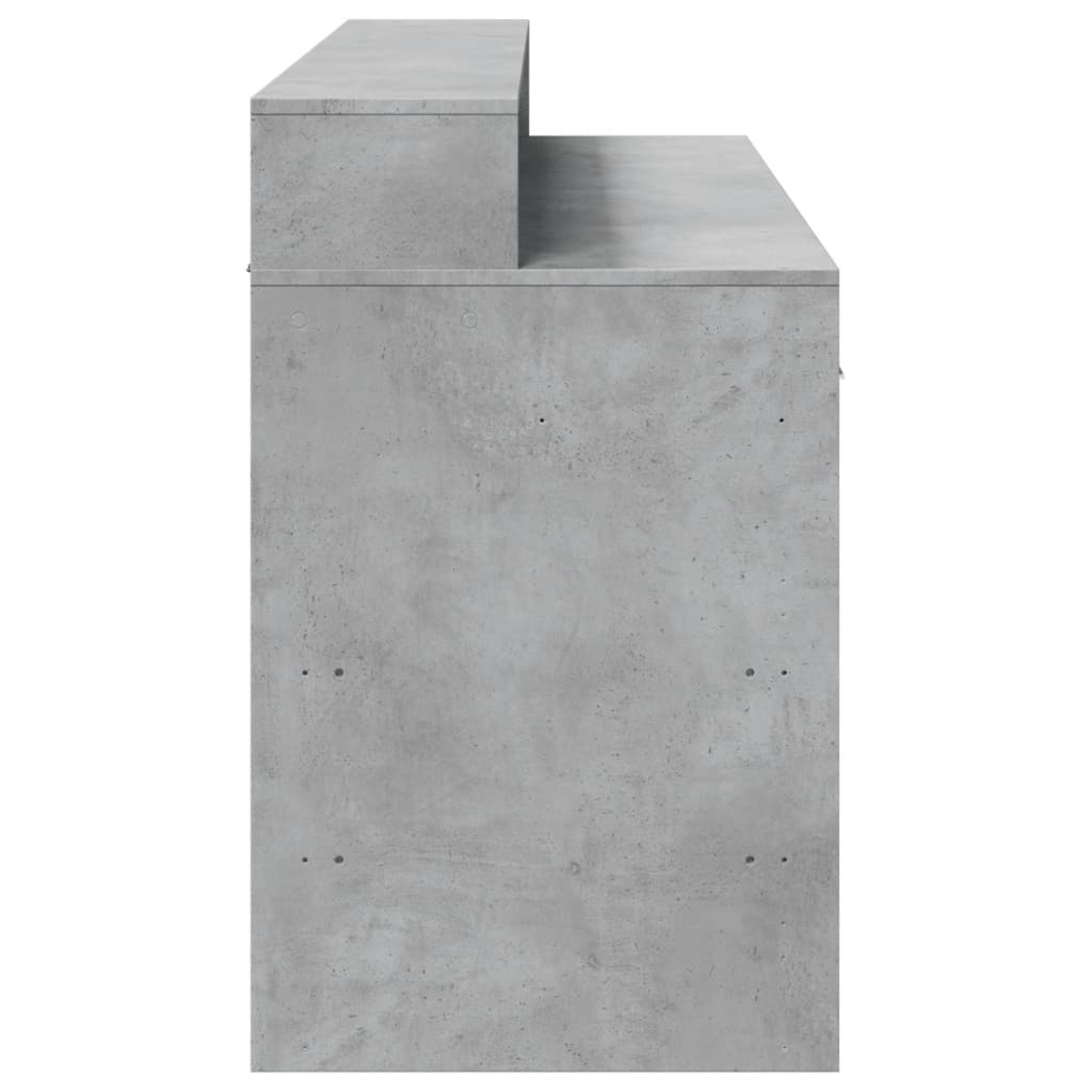 Graues Betonmöbel mit abgestufter Oberseite, von der Seite gezeigt.