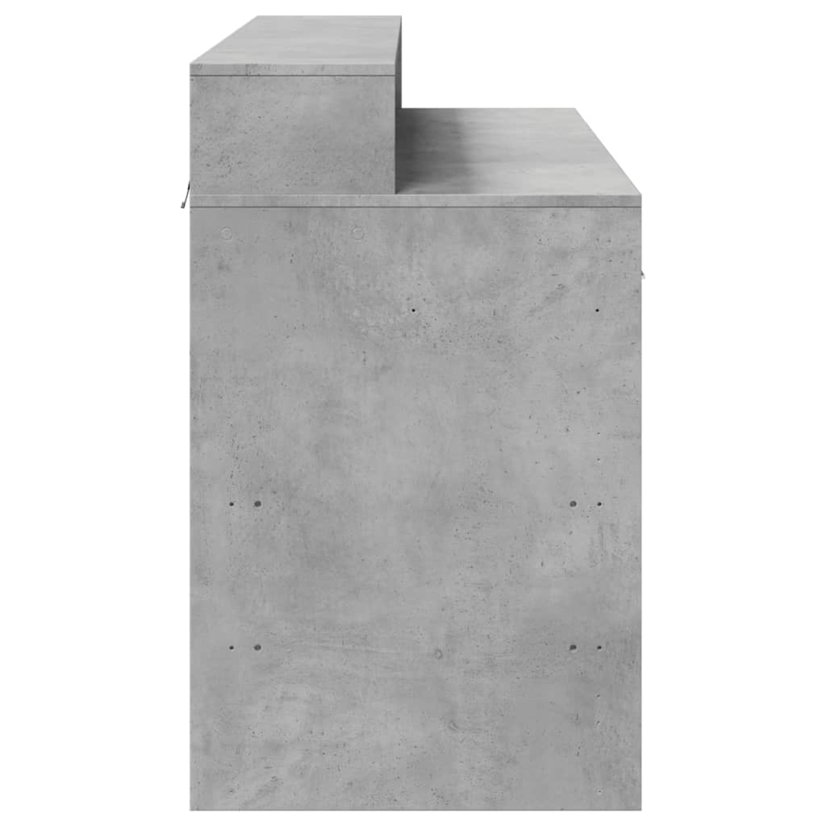 Ein grauer Betonwürfel mit einer Stufe darauf, von der Seite gesehen.