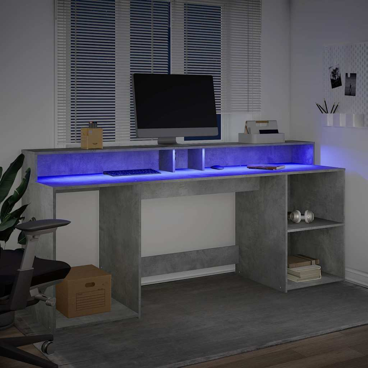 Ein moderner Schreibtisch mit blauer LED-Beleuchtung, einem Computer und einem Bürostuhl.