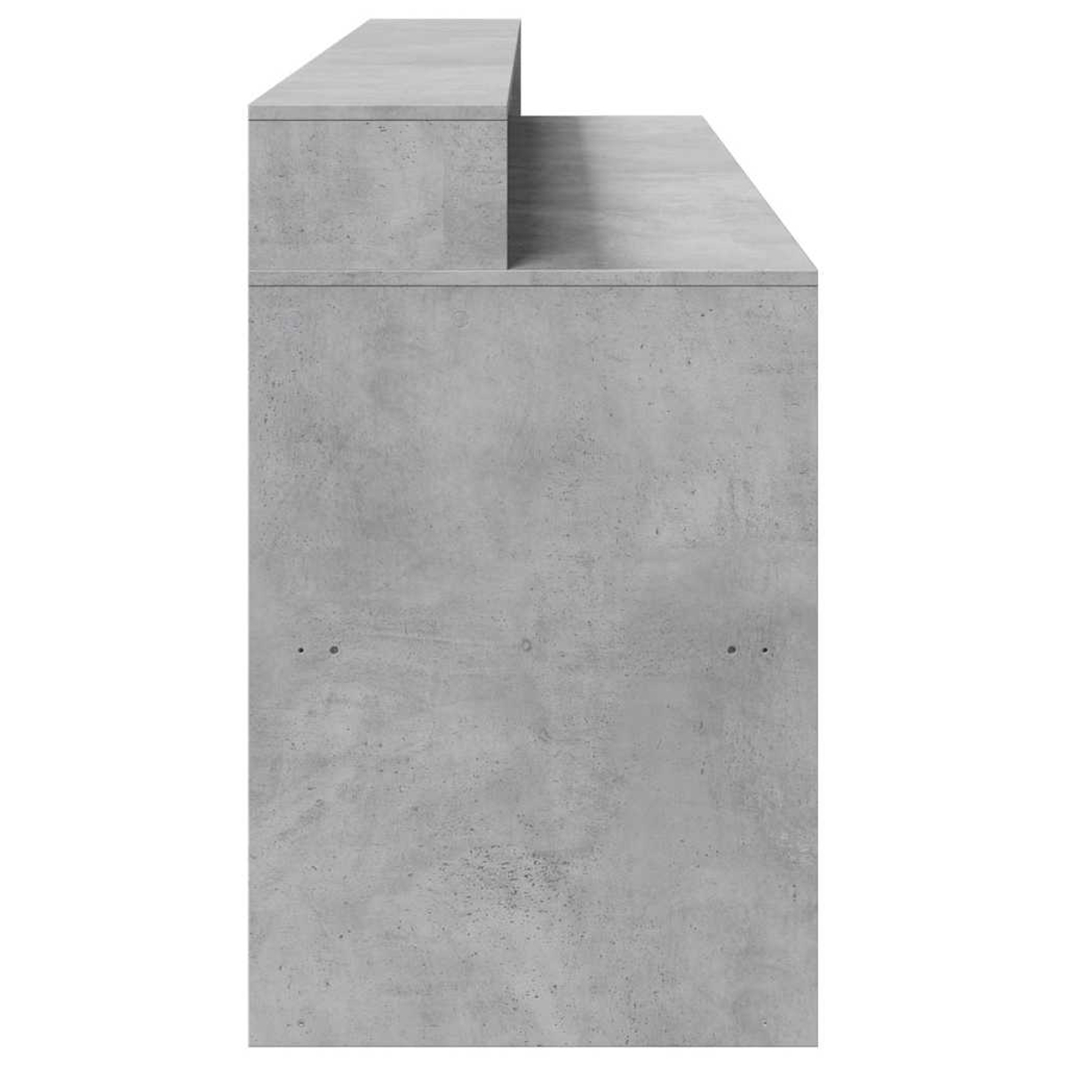 Graues Betonmöbel mit zwei Ebenen und einem vertieften Bereich.