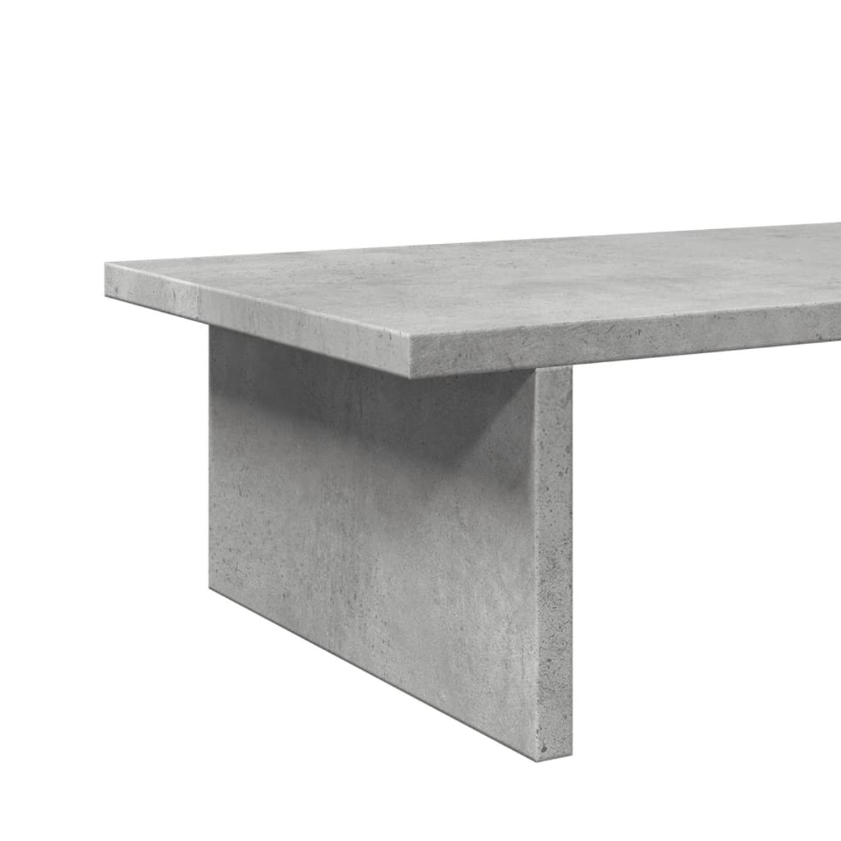 Ein grauer Beton-Tisch mit einer schlichten, modernen Form.