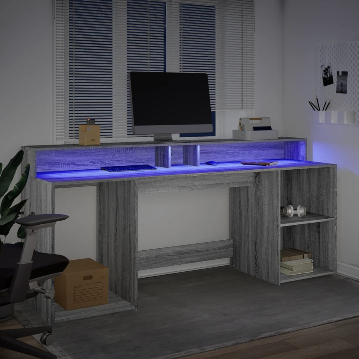 Ein moderner Schreibtisch mit blauem LED-Licht, Monitor, Tastatur und Maus.