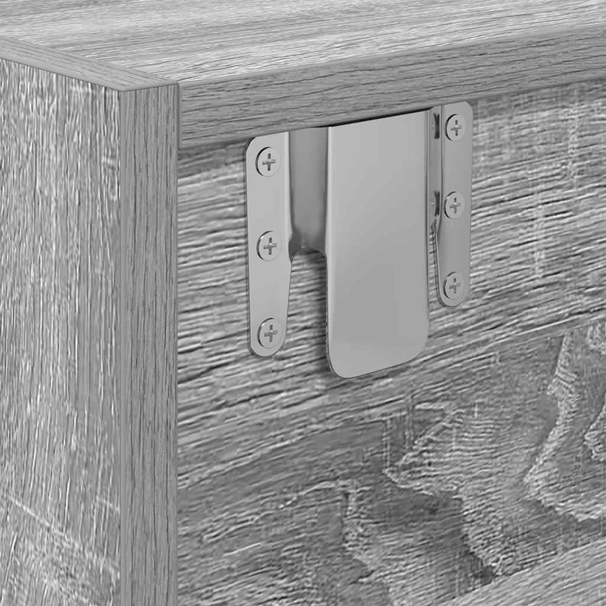 Eine Nahaufnahme einer Metallhalterung, die mit Schrauben an einem Holzmöbel befestigt ist.