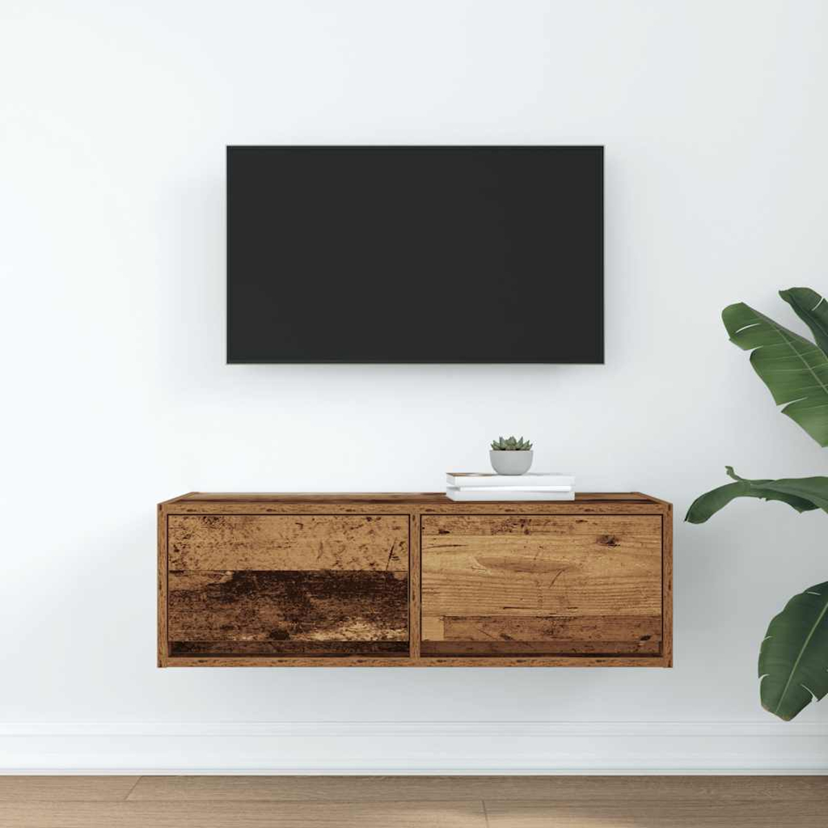 Ein schwarzer Flachbildfernseher hängt über einem rustikalen Holz-Wandregal mit zwei Schubladen. Eine kleine Sukkulente ruht oben.