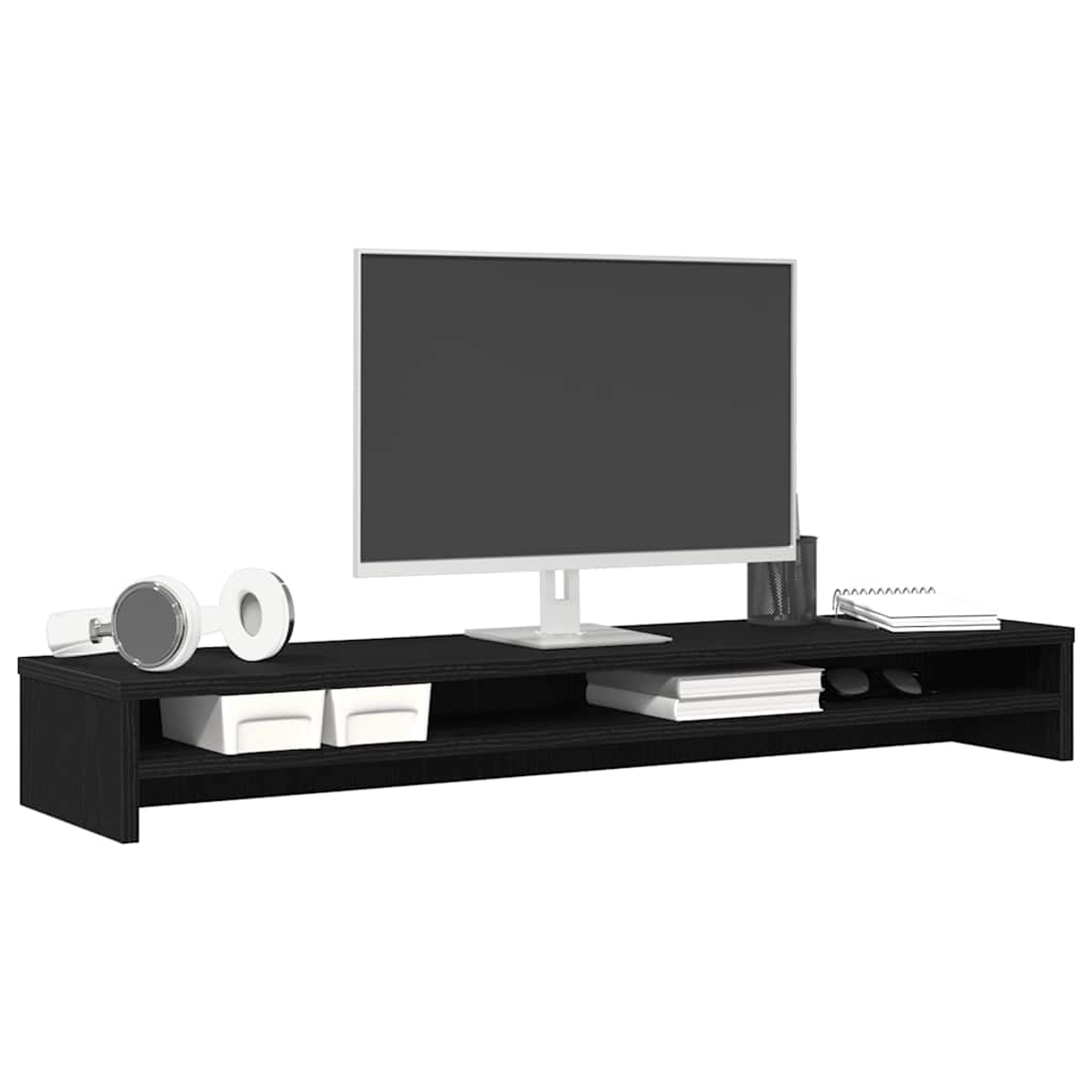 Ein schwarzes TV-Möbel mit einem Monitor, Kopfhörern, Büchern und Aufbewahrungsboxen.