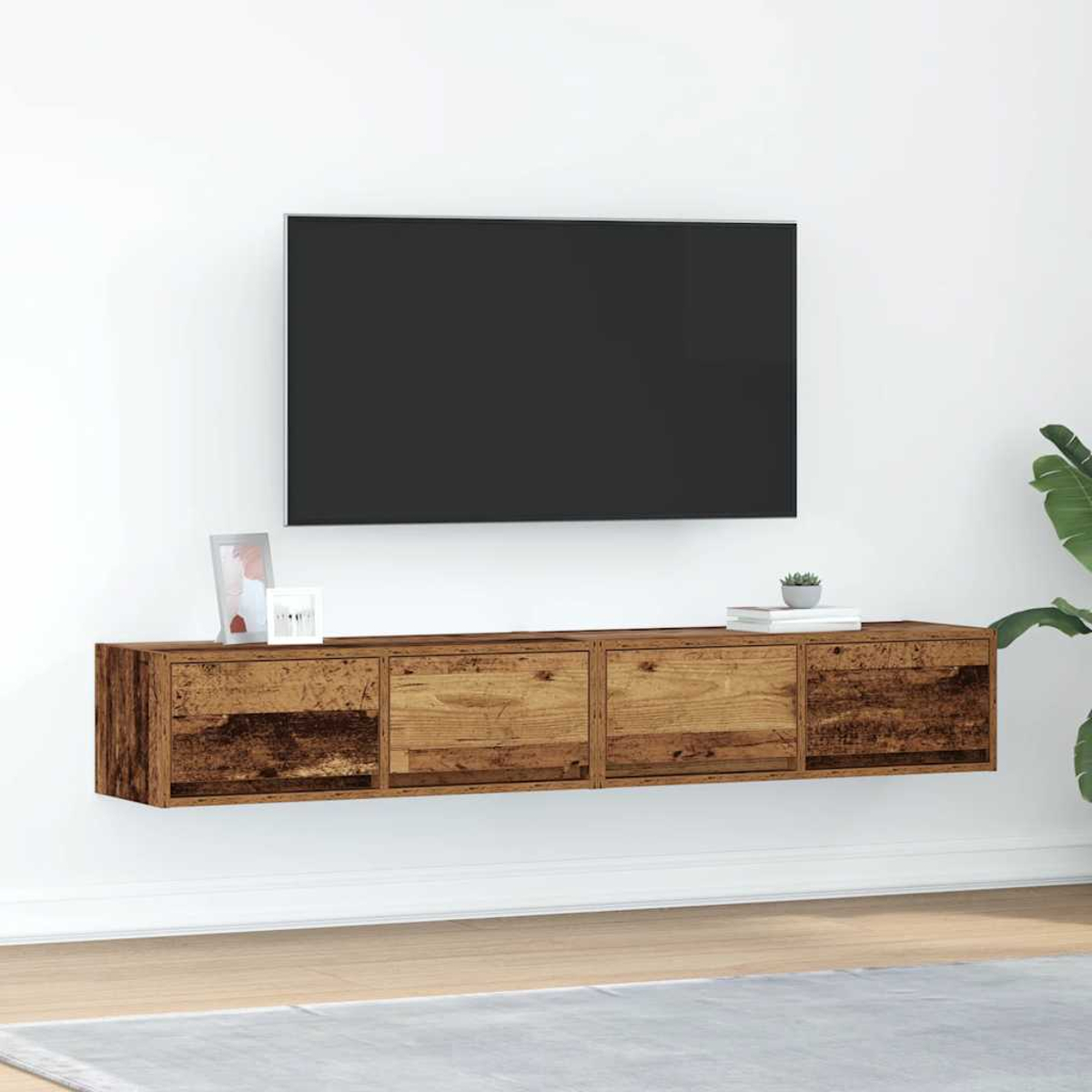Eine holzmaserierte Wandhalterung mit Schubladen unter einem schwarzen Fernseher.