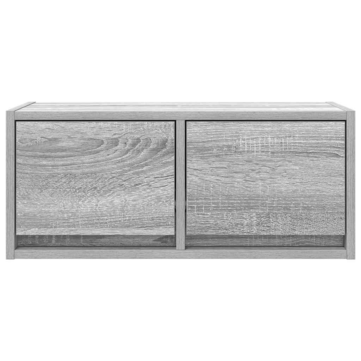 Graues Holzschrank mit zwei Türen und sichtbarer Maserung.