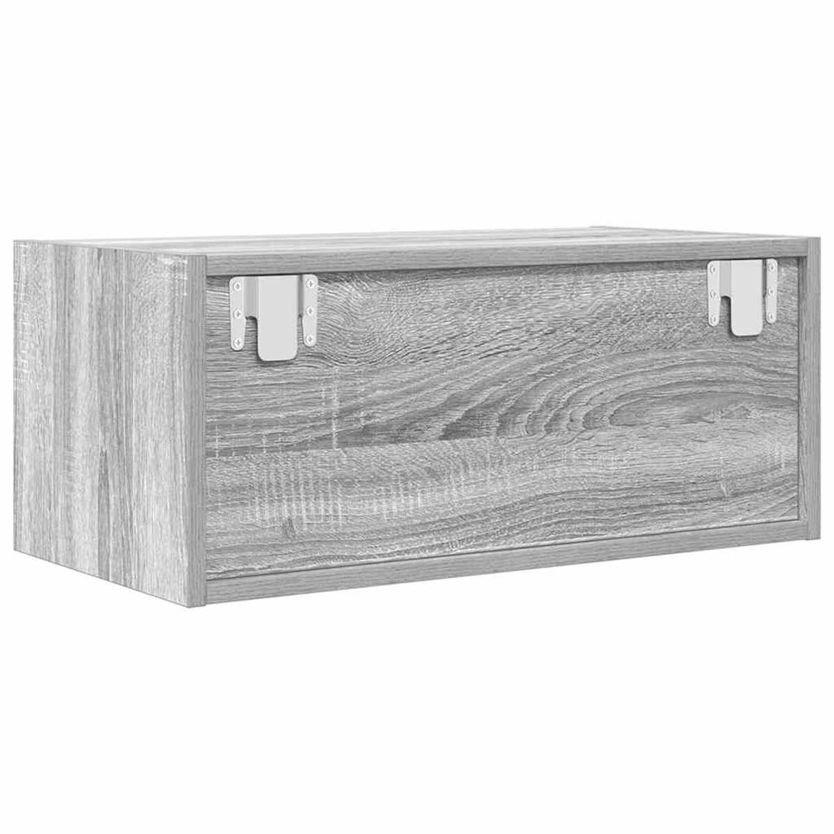 Graues Holzmöbel mit Metallbeschlägen und sichtbarer Maserung.