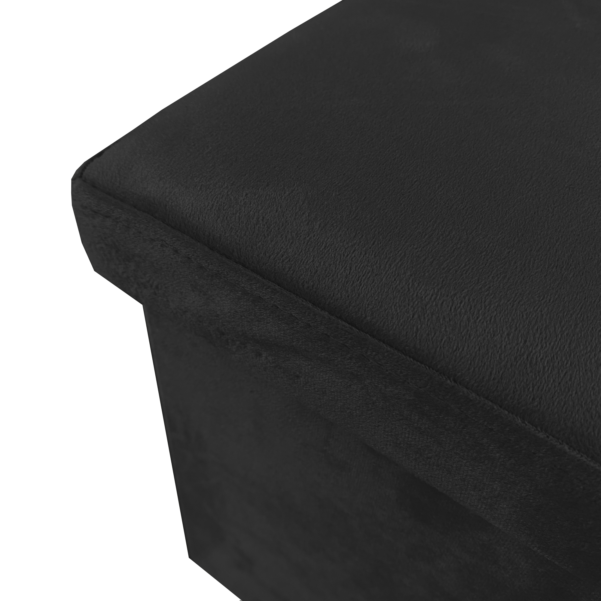 Un otomano negro con funda de tela suave, vista de cerca.