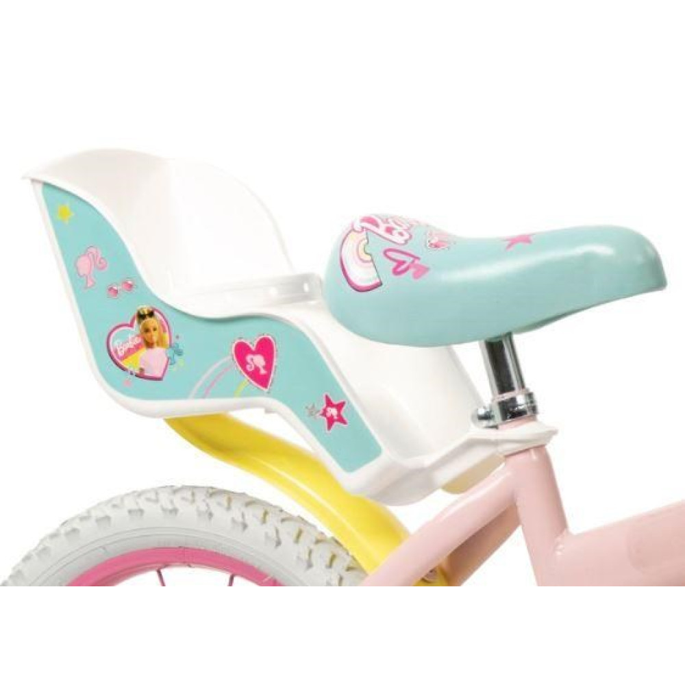 Różowy rower z motywami Barbie i fotelikiem dziecięcym z tęczami i sercami.