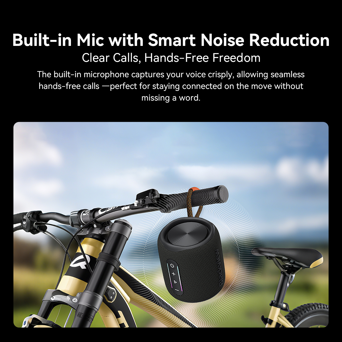 Black speaker on bicycle handlebars with wave pattern. Sky and grass in background.