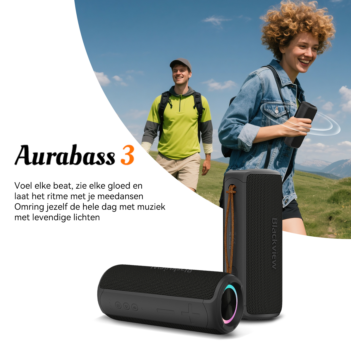 Two black Bluetooth speakers with glowing rings on a mountain meadow.