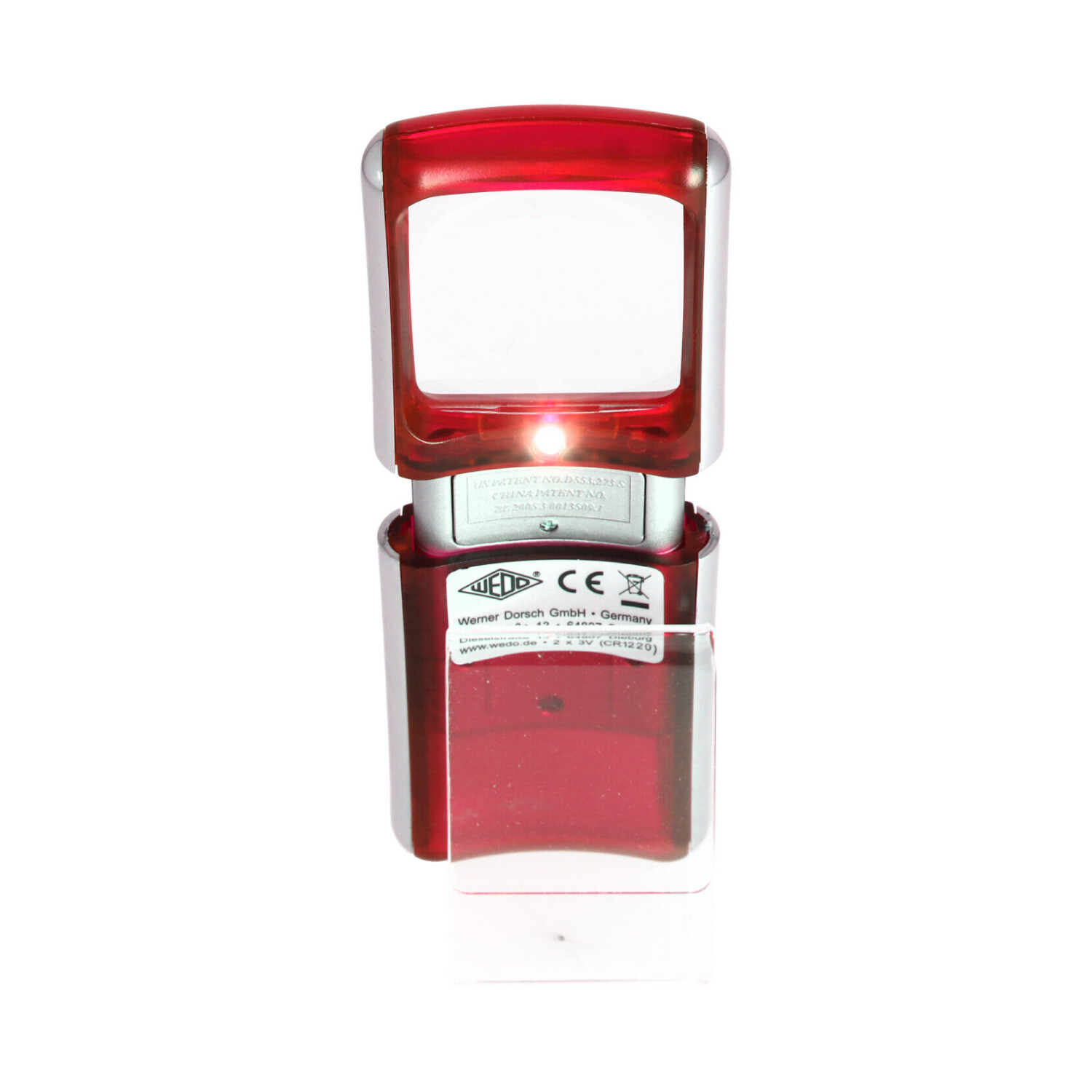 Ein roter und silberner Stempel mit Licht auf weißem Hintergrund.