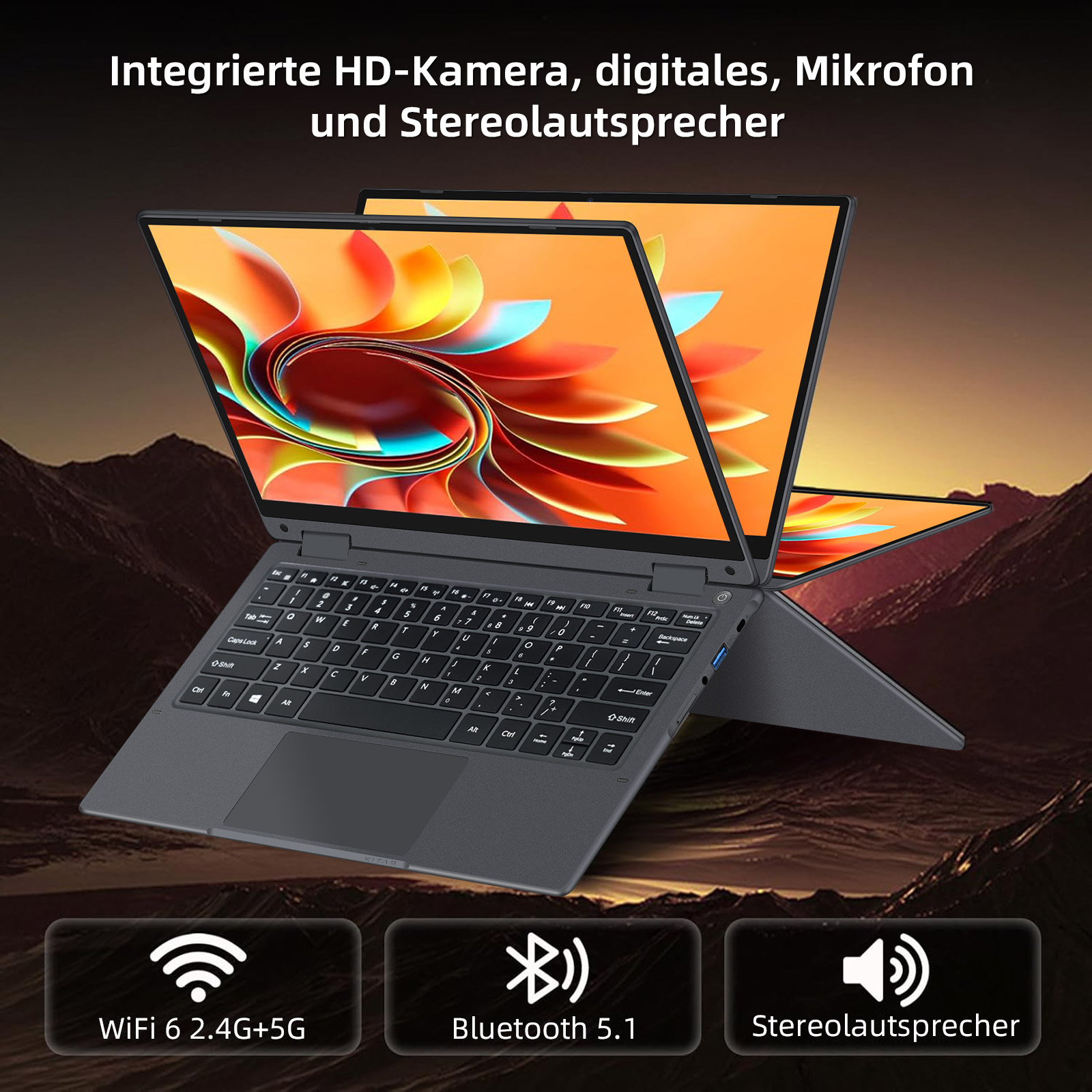Ein geöffneter Laptop mit buntem Hintergrund und Berglandschaft.