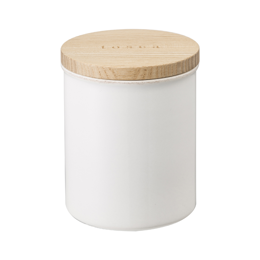 Un contenitore bianco con coperchio in legno inciso TOSCH.