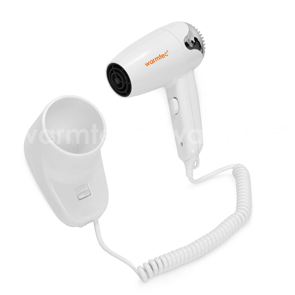 Biała, kompaktowa suszarka do włosów ze spiralnym kablem i bazą ładującą.