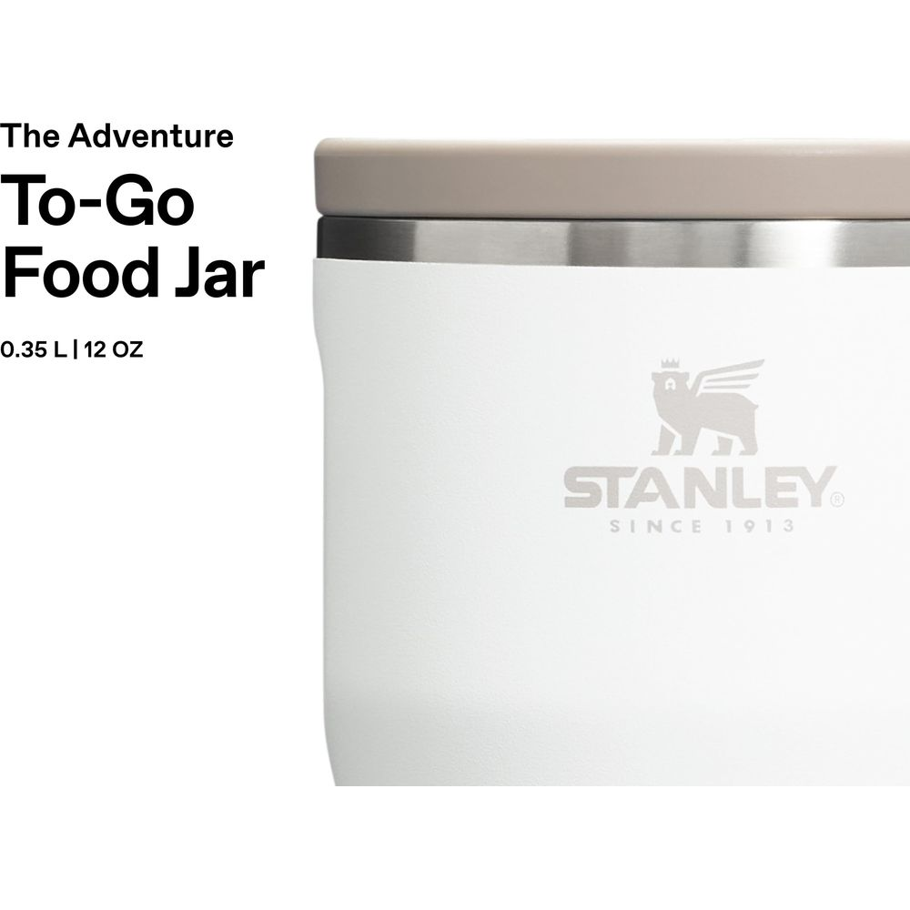 Bocal alimentaire blanc Stanley To-Go avec couvercle et logo beiges. Texte: The Adventure To-Go Food Jar.