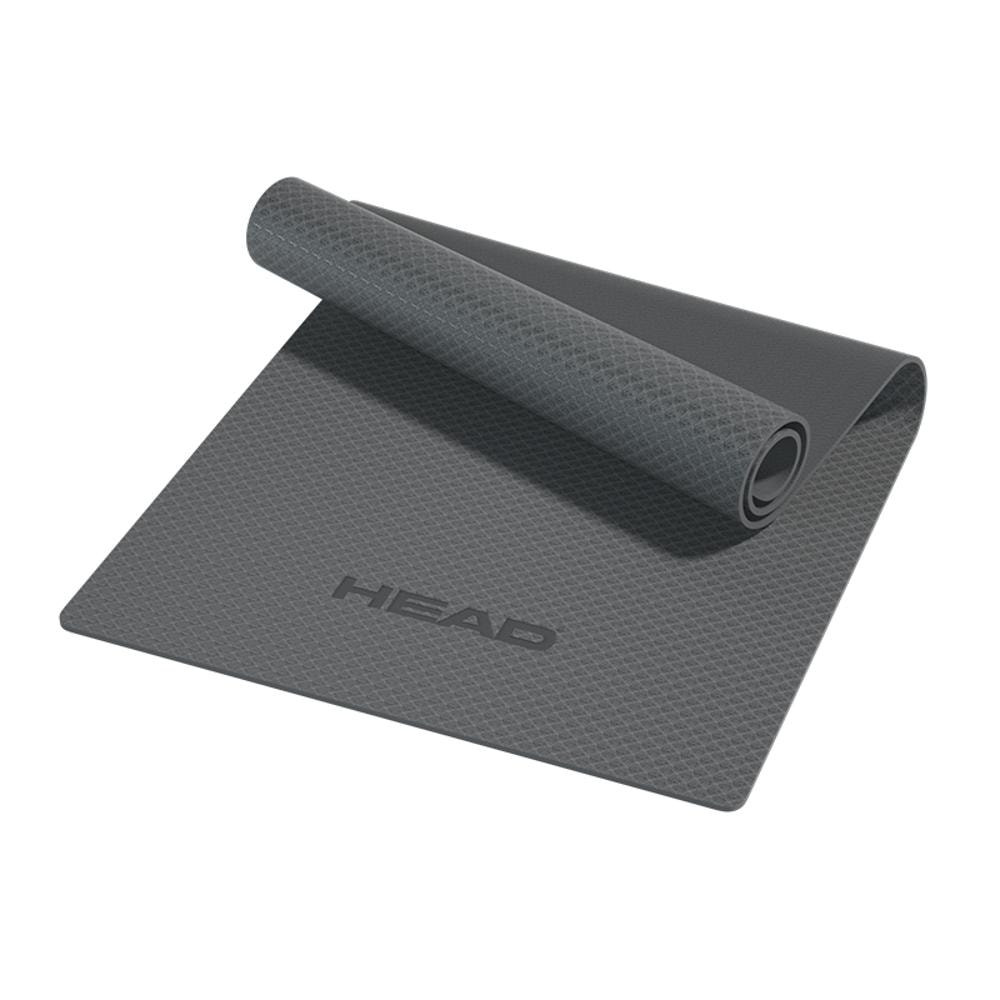 Graue Yogamatte mit TEXTUR und aufgerolltem Ende mit dem HEAD-Logo.
