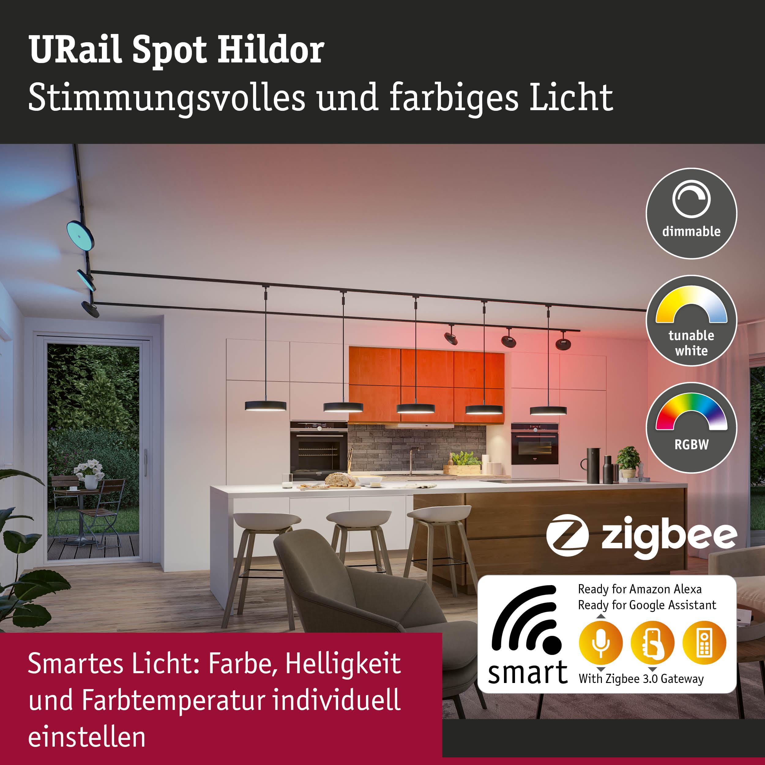Eine moderne Küche mit einer Lichtleiste und verstellbaren Spots, die farbiges Licht abgeben.