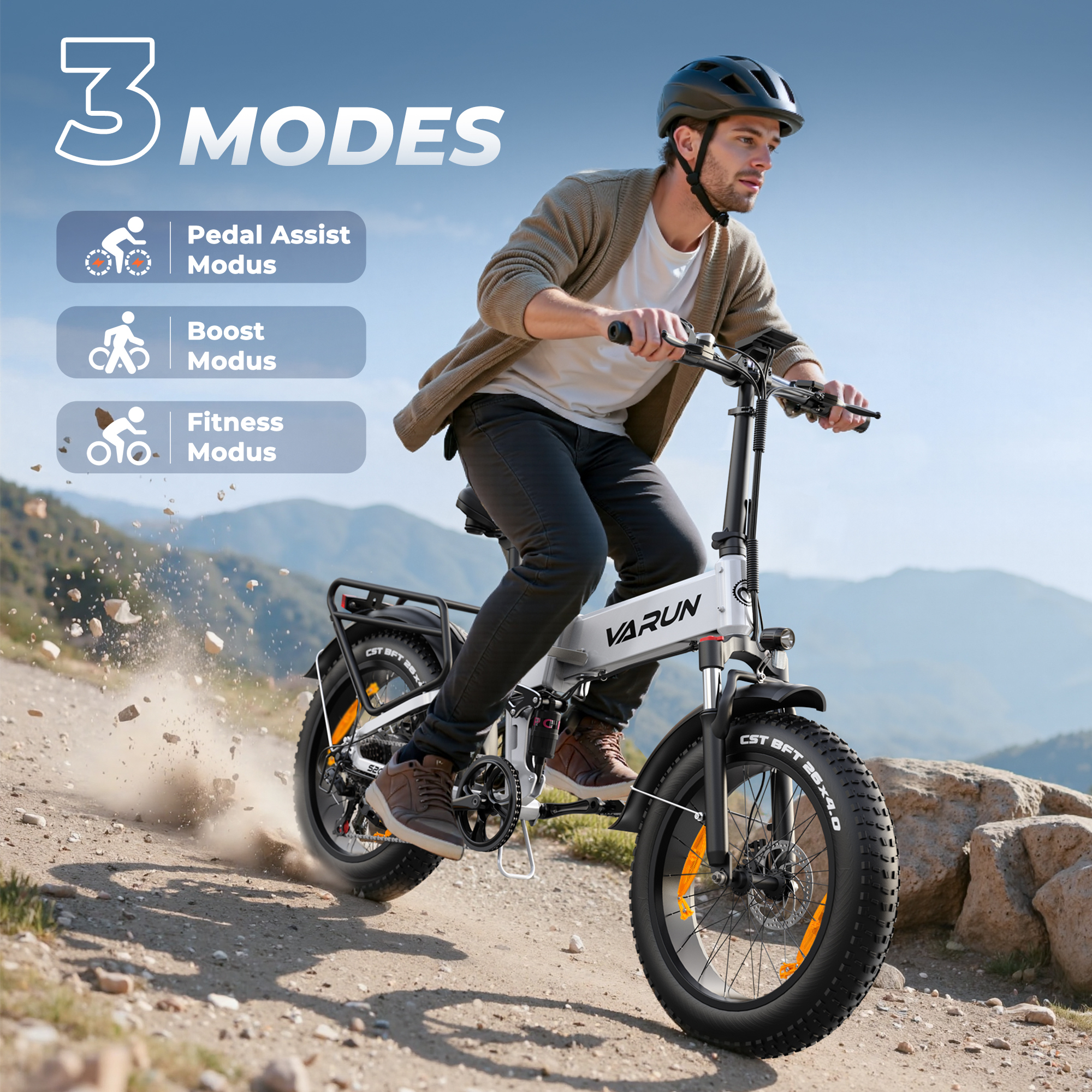 Mężczyzna na białym rowerze elektrycznym z grubymi oponami na polnej ścieżce.