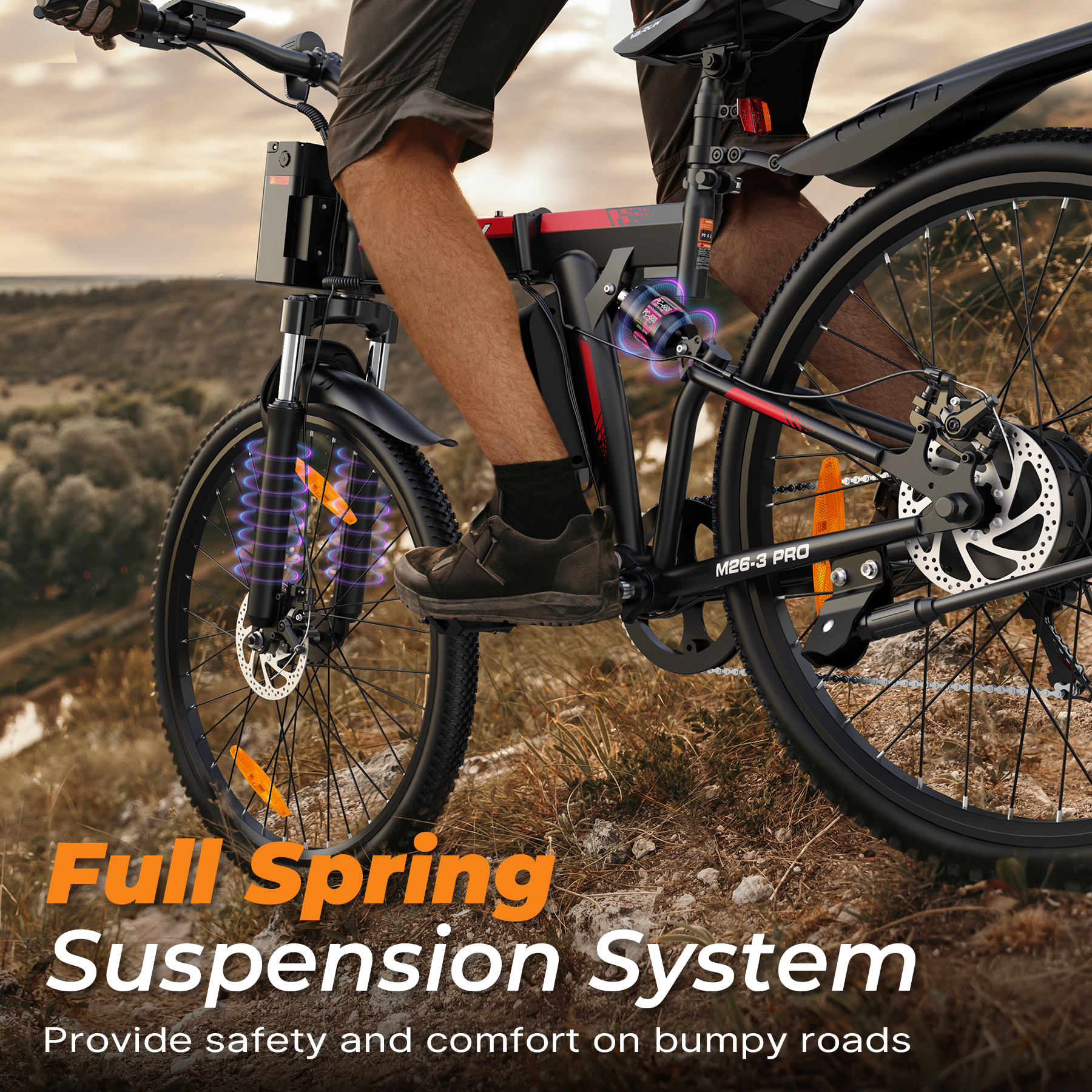 Mężczyzna jedzie na rowerze elektrycznym z pełnym zawieszeniem po pagórkowatym.