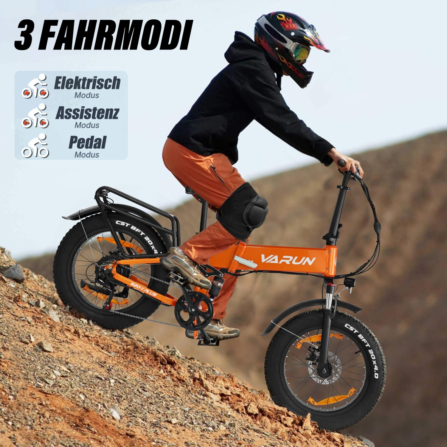 Osoba w kasku jedzie pod górę na pomarańczowym rowerze elektrycznym z grubymi oponami.