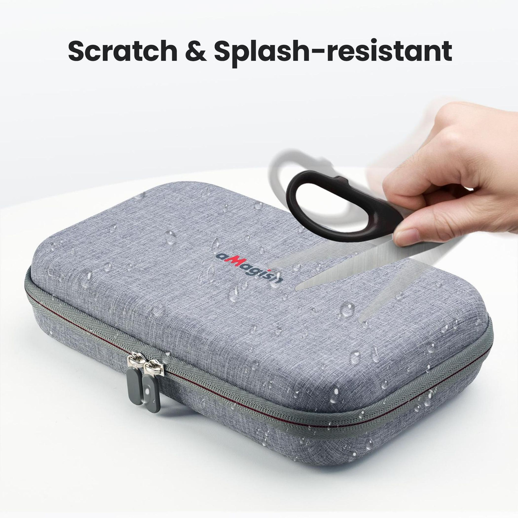 Grauer Koffer mit Wassertropfen, Schere schneidet das Logo.