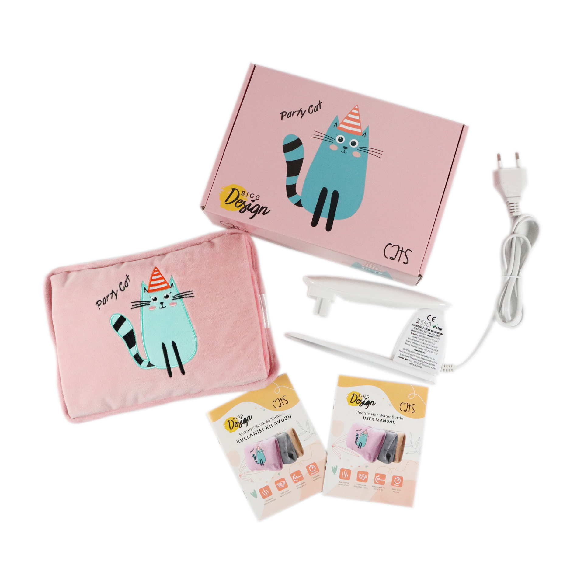 Una caja rosa con diseño de gato fiestero, un cojín de gato rosa, dos manuales y un cable de alimentación blanco.