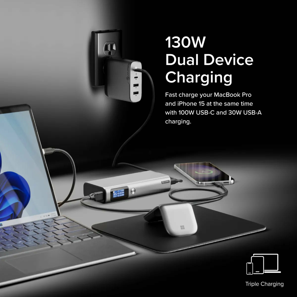 Un laptop, un power bank e uno smartphone si caricano da un caricatore a muro.