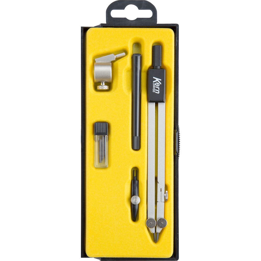 Un set di strumenti da disegno Kern in astuccio giallo con compasso argentato e matite.