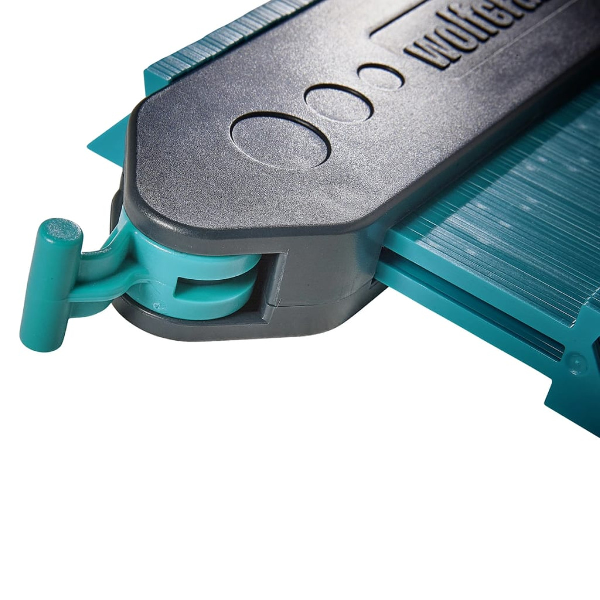 Strumento per tracciare contorni con perni color verde acqua e manico nero.