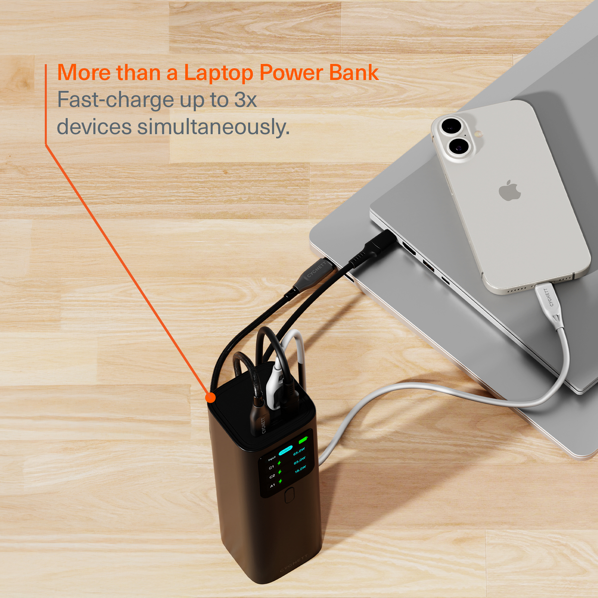 Une banque d'alimentation noire charge un ordinateur portable et un téléphone. Texte : Plus qu'une banque d'alimentation pour ordinateur portable.