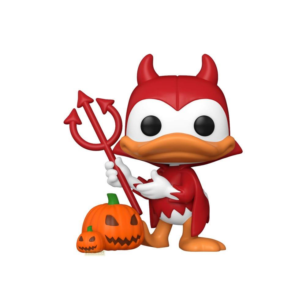 Una figura de diablo roja con tridente junto a calabazas.