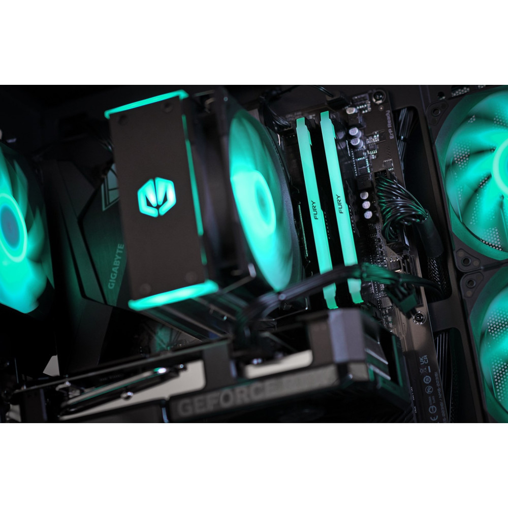 Zielone neonowe wnętrze komputera z RAM i wentylatorami.