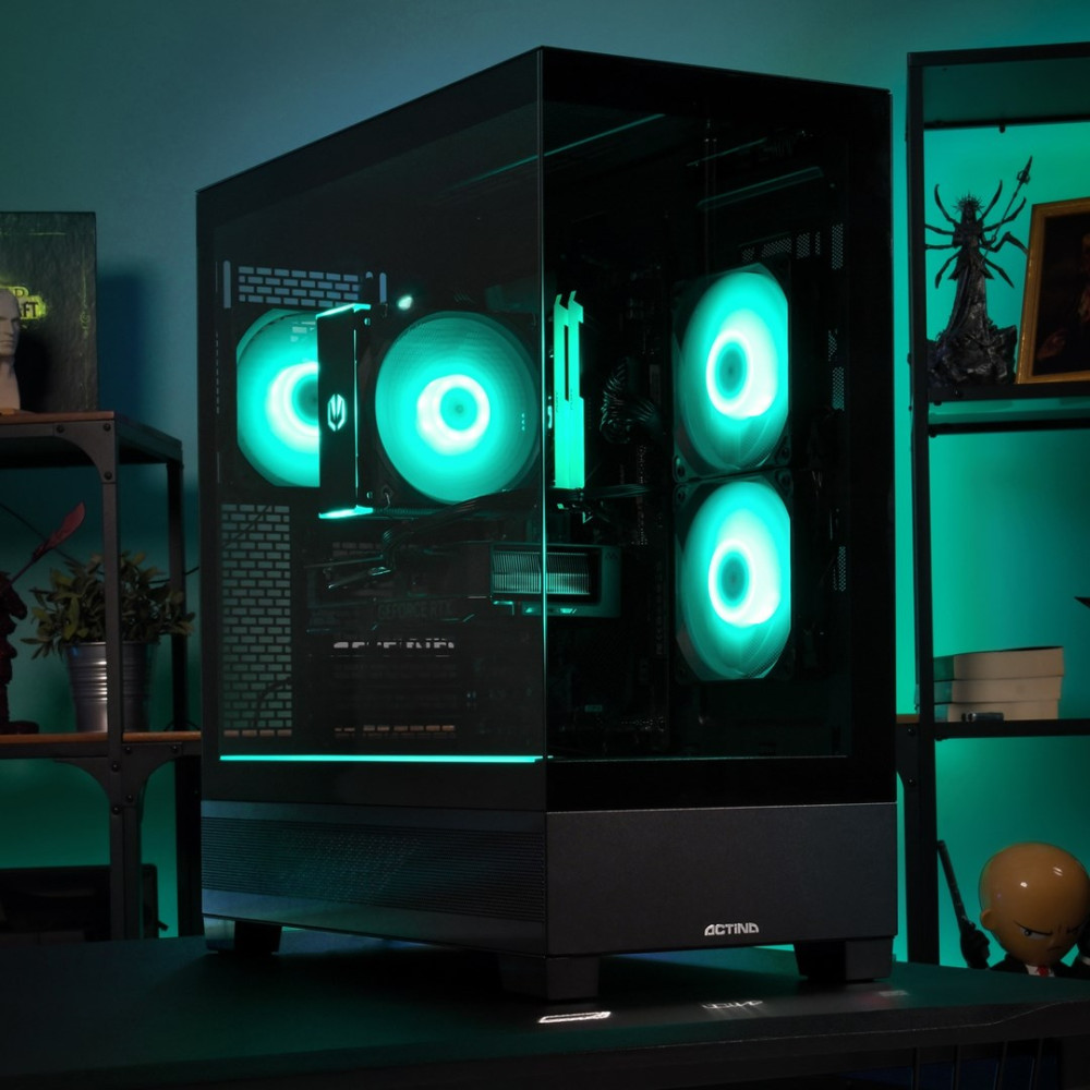 Una torre PC nera con illuminazione verde e ventole visibili è posizionata su una scrivania.