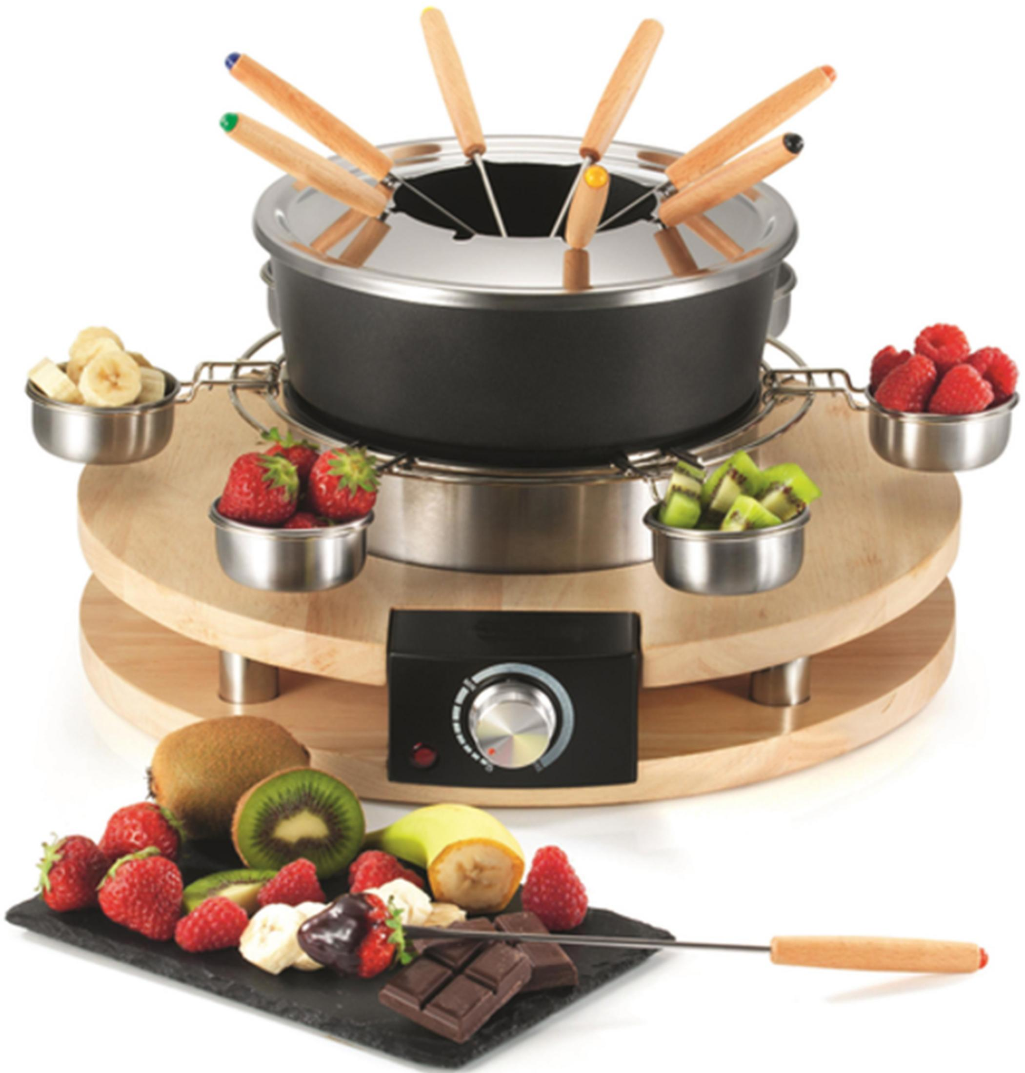Un set da fonduta con frutta e cioccolato, pronto per l'inzuppo.
