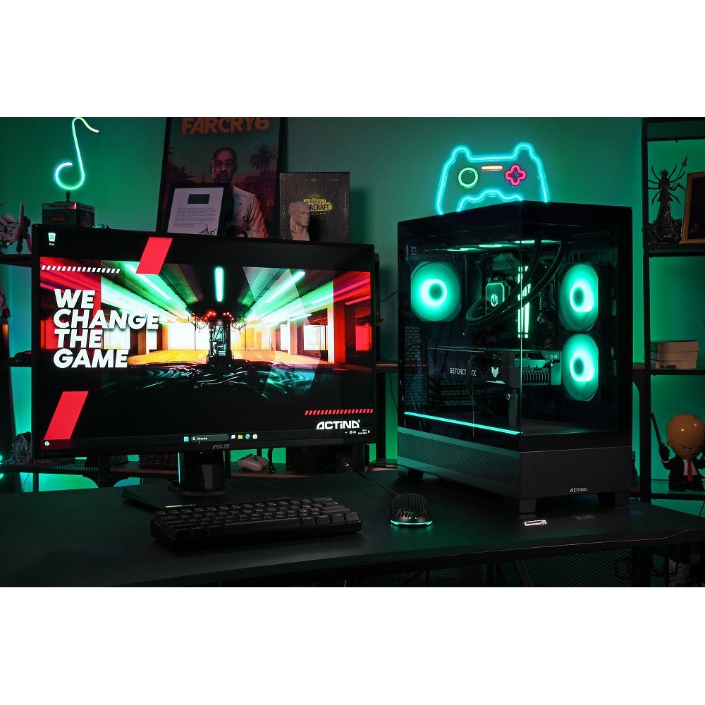 Komputer gamingowy z wentylatorami RGB obok monitora z jasną grafiką.