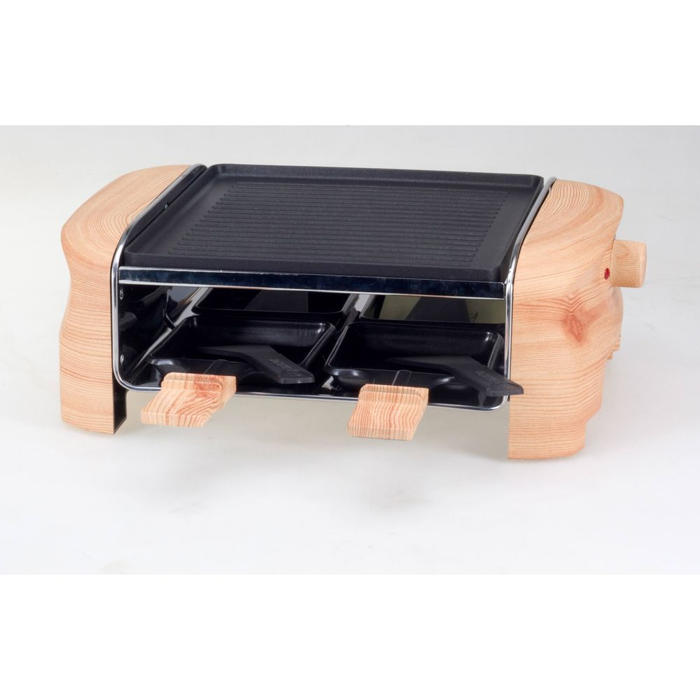 Una griglia per raclette con cassa in legno e piastra.