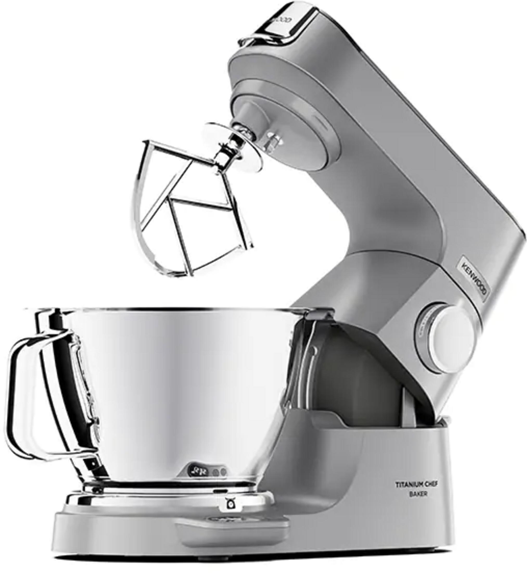 Una planetaria Kenwood argento con ciotola e frusta in metallo.