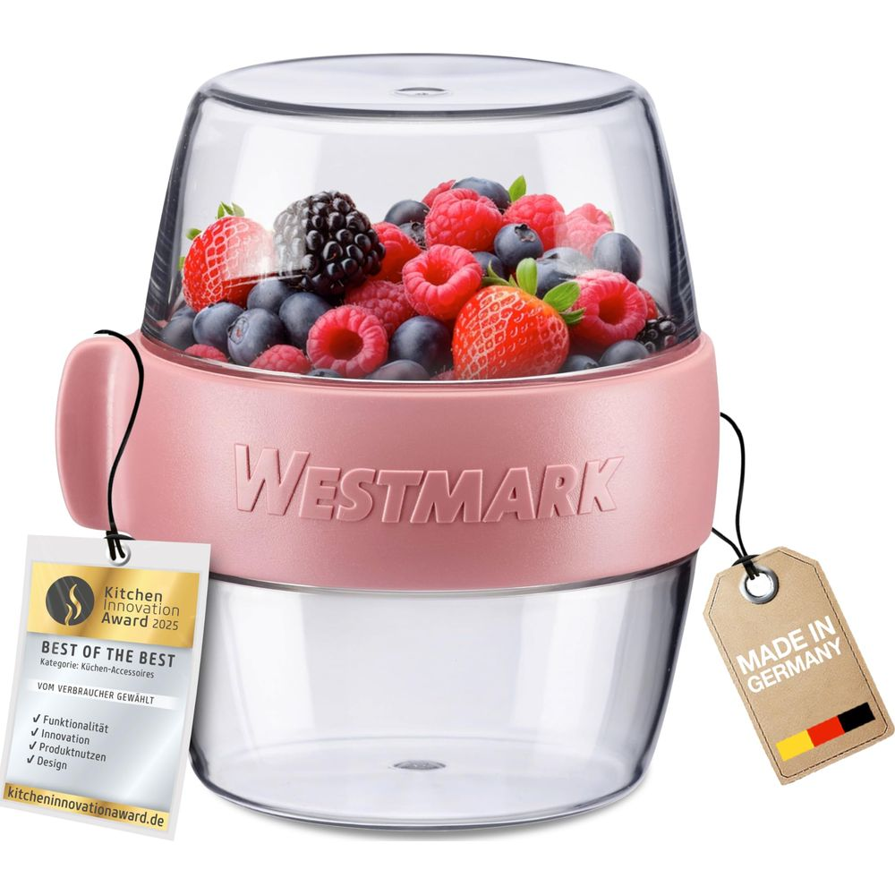 Ein rosa Westmark-Mixer gefüllt mit Beeren, mit Auszeichnungen.